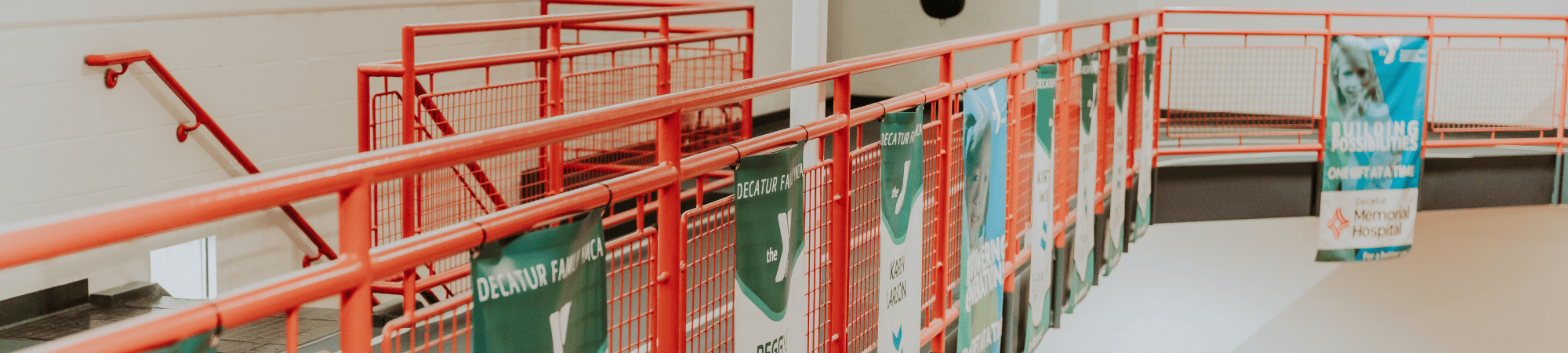 donor banners hanging from a railing