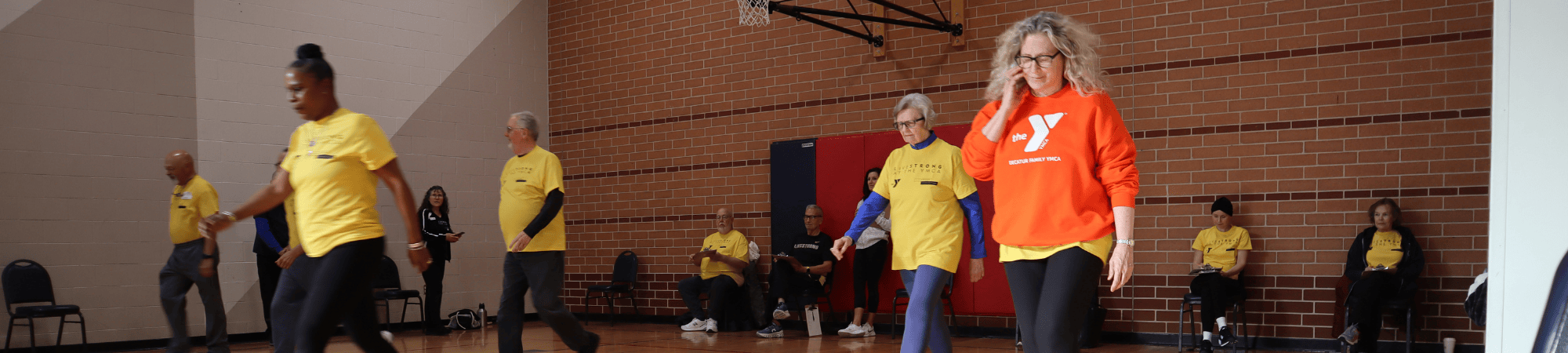 Livestrong participants walking in a gym